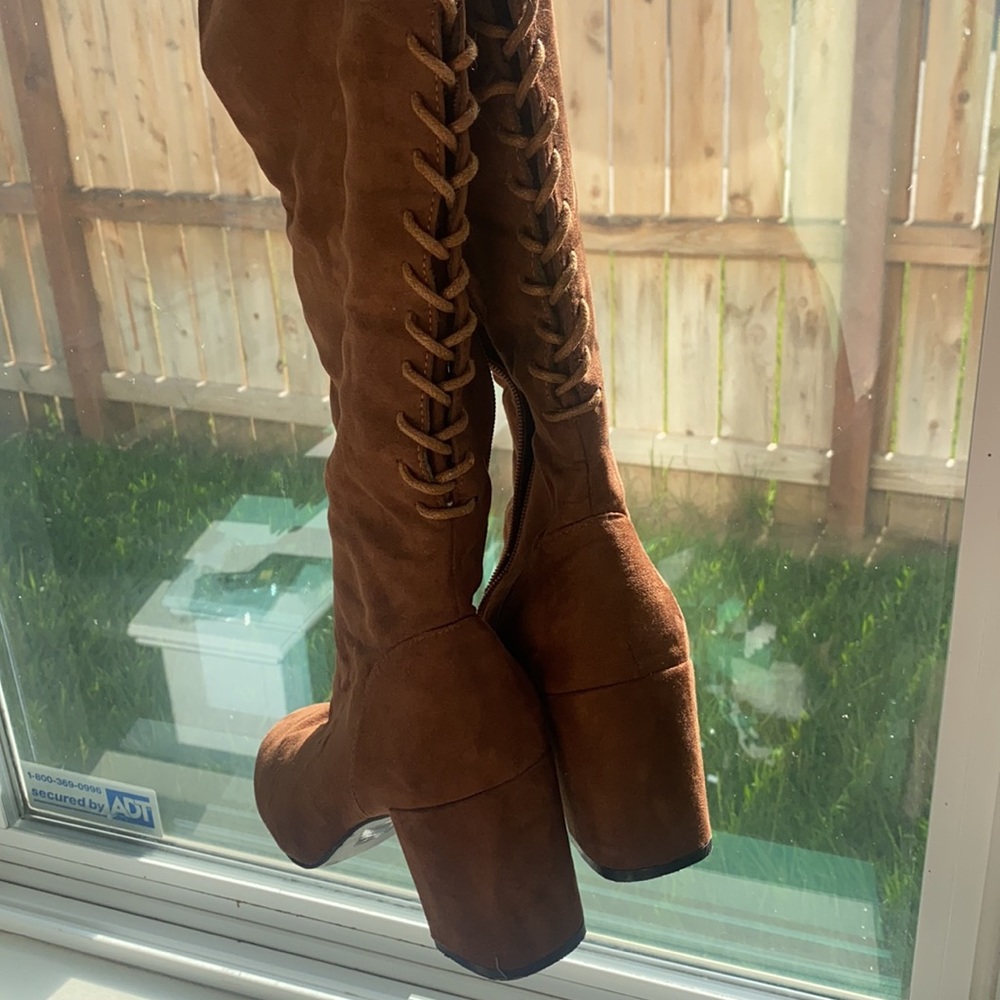 Knee high brown lace up boots